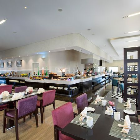 The Tower Plaza Hotel Dubai Buitenkant foto The hotel's restaurant